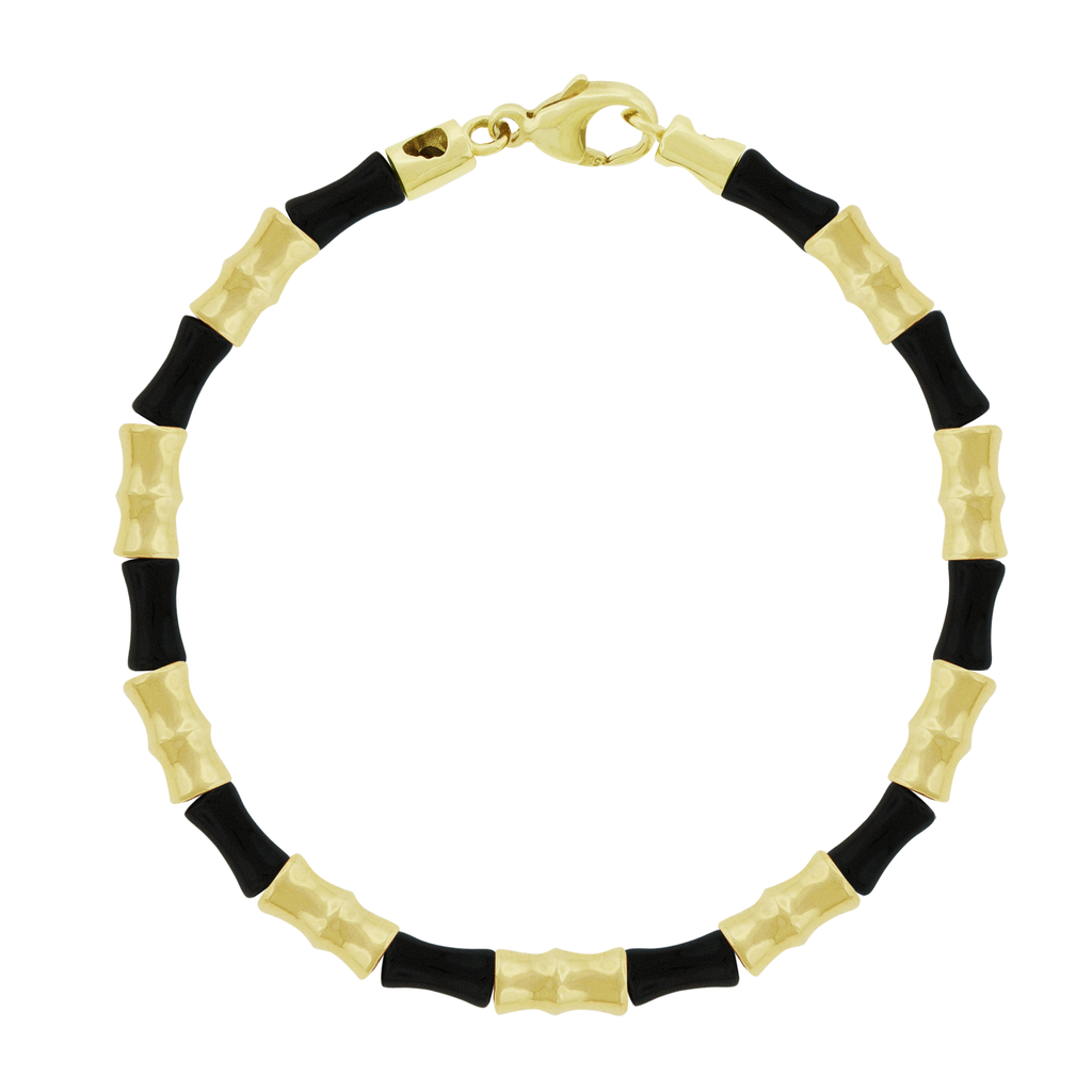 This LUIS MORAIS bracelet features 14k yellow gold Bamboo tubes alternating with glass beads. Lobster clasp closure. Bamboo symbolizes strength, resilience, and the ability to grow through adversity.