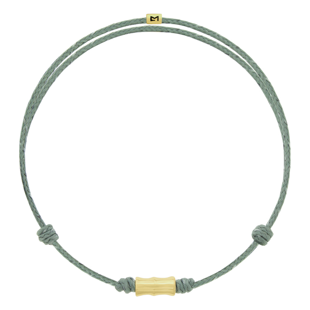 LUIS MORAIS 14k yellow gold Bamboo tube on an adjustable cord bracelet. Gold logo spacer.