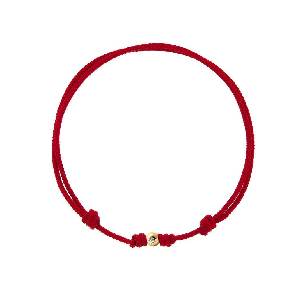 LUIS MORAIS small yellow gold ball with diamond on a red cord bracelet